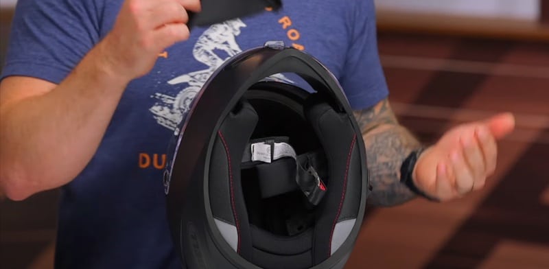 The interior features anti-microbial liners treated with Aegis coating that prevents odor buildup during long rides. The removable interior liner comes out easily for washing and includes moisture-wicking cheek pads that manage sweat effectively during summer riding.