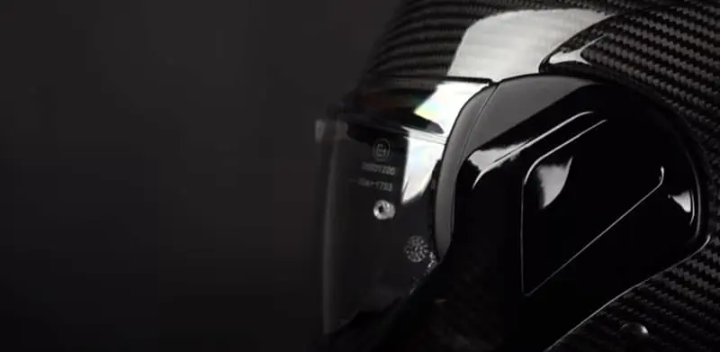 The HJC F100 solid carbon visor offers a wide field of view, with plenty of peripheral sight that matches high-end full face open lids.